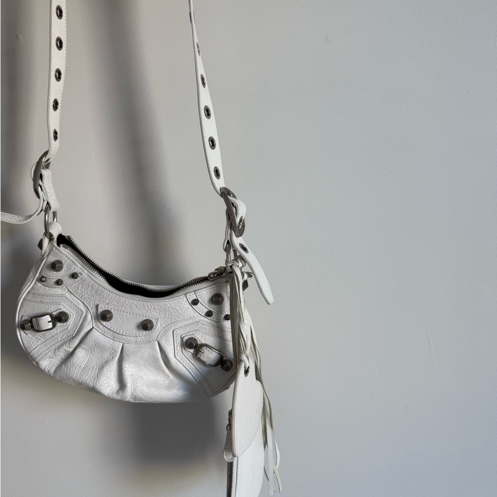 BALENCIAGA Le Cagole xs leather shoulder bag in white.